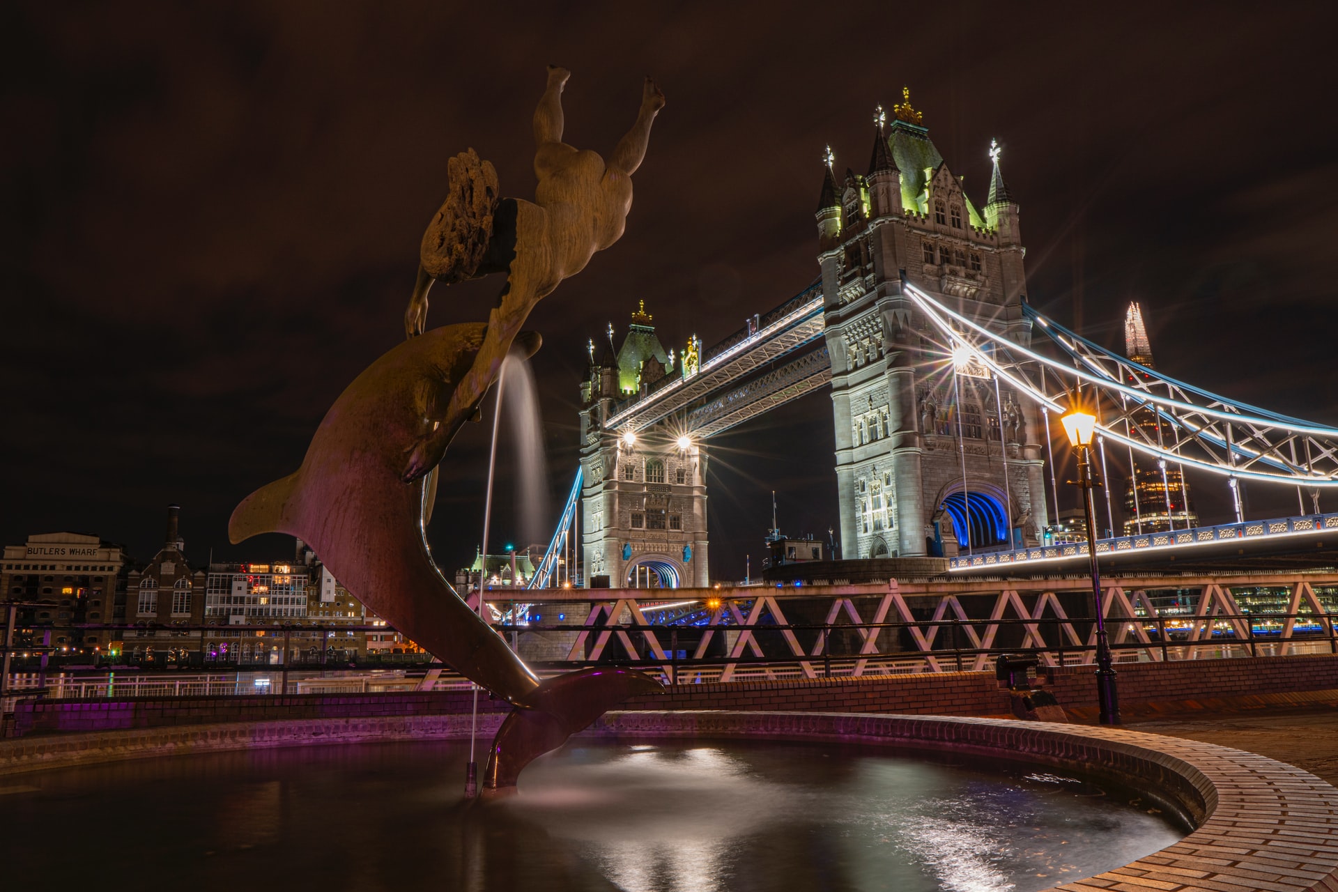 A dolphin fountain infront of London Bridge